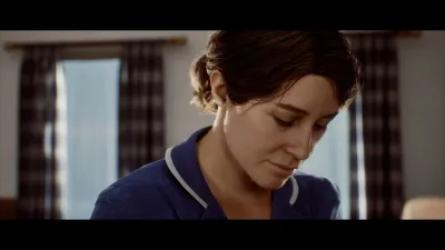 Woman in a blue uniform looking down in a Townfall interior
