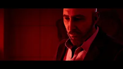Man in a suit looking sideways in red light in Townfall