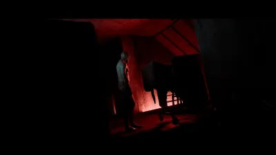 Figure silhouetted in a red-lit doorway in Townfall